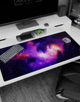 Cosmic nebula scene desk pad with floating stars on dark space background, 40x20 inches.