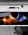 Moody 36x16 inches desk pad in midnight blacks with blazing orange glow and icy blue smoke tones.