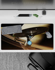 Cozy sci-fi mouse pad 32x16 inches in warm sand tones, smoky shadows, and icy blue engine glow.