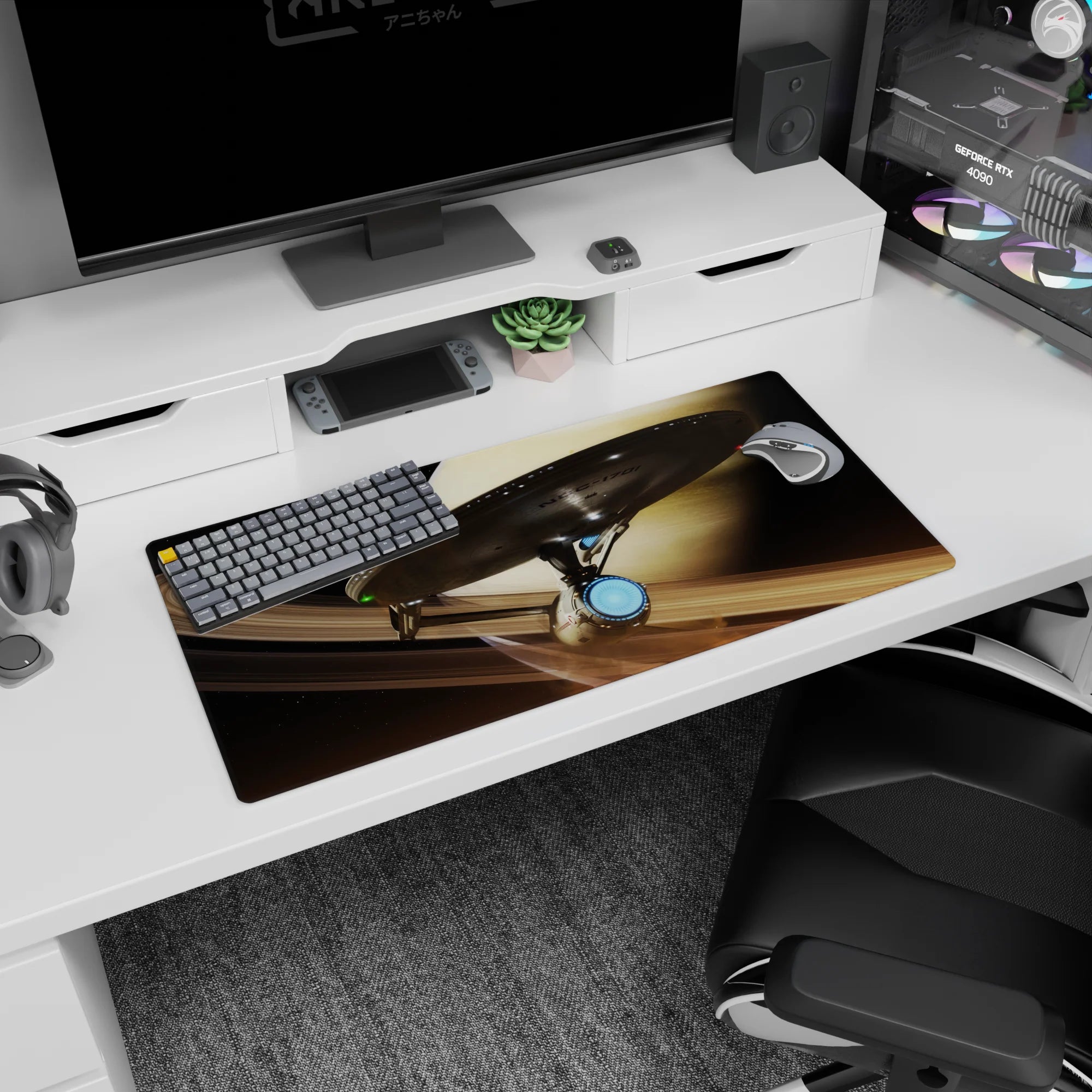 Sleek starship cruising past a beige ringed planet on a 32x16 inches mouse pad, in dark cozy space.