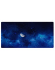 Midnight galaxy desk mouse pad 32x16 inches with swirling sapphire clouds, scattered stars, and soft gradients.