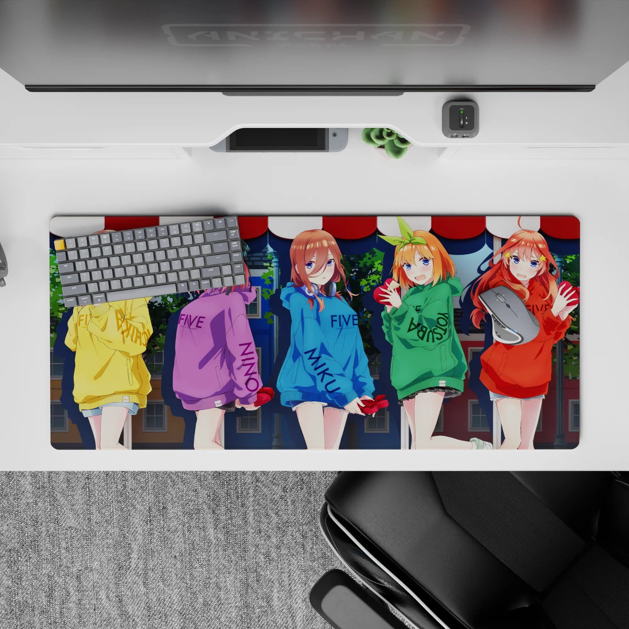 Colorful anime desk pad 36x16 inches in yellow, purple, blue, green, and red hoodies with warm shy vibes.