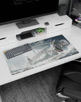32x16 inches mouse pad showing lone anime girl in sleek uniform with red ribbon, rifle by her boots in dust.