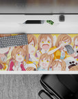 Sunny orange anime girl desk pad 36x16 inches, cheerful cozy vibe with warm brown and pastel tones.