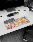 28x12 inches anime girl mouse pad featuring brown-haired, golden-eyed girl snacking, blushing, and smiling.