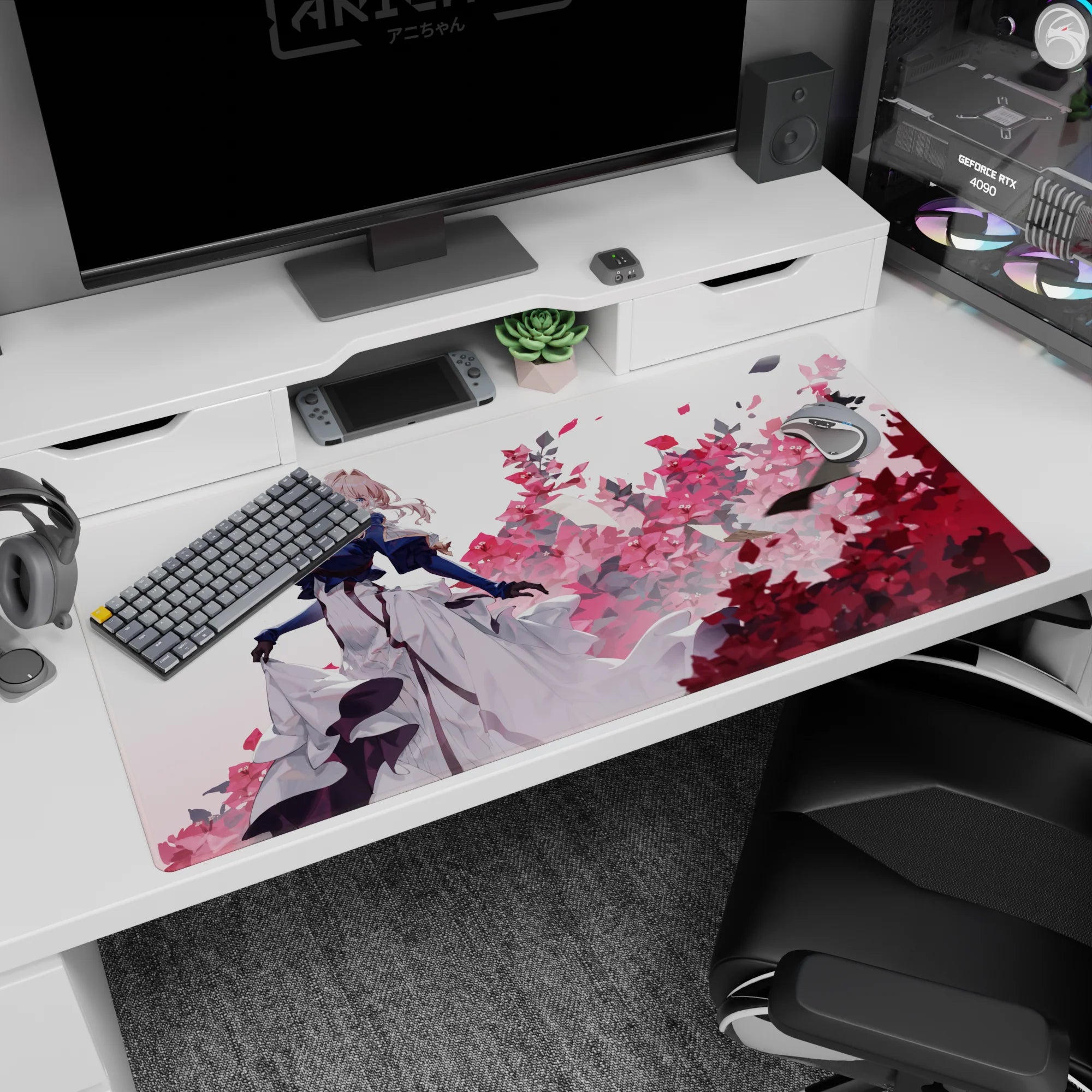 Blonde anime girl in gloves, navy coat and flowing white dress amid pink blossoms on 40x20 inches desk pad.