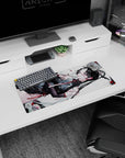 28x12 inches anime mouse pad showing a teasing black-haired girl lounging sideways in gloves and ribbon.