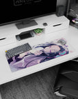 32x12 inches mouse pad showing a sleepy violet-eyed anime girl curled on her side, dark hair flowing.