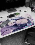 Anime girl curled on her side desk pad 40x20 inches, long dark hair, violet eyes, blossoms on sleeves.