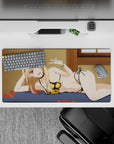 32x16 inches desk mat in warm blonde and soft pink tones, black bikini with gold flowers, cozy navy bed.