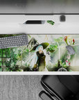Cozy green and gold desk pad 36x16 inches, sunlit greenhouse anime art with warm lantern glow.