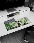 Blue-eyed witch girl holding tiny black cat in sunlit greenhouse anime mouse pad 28x12 inches.