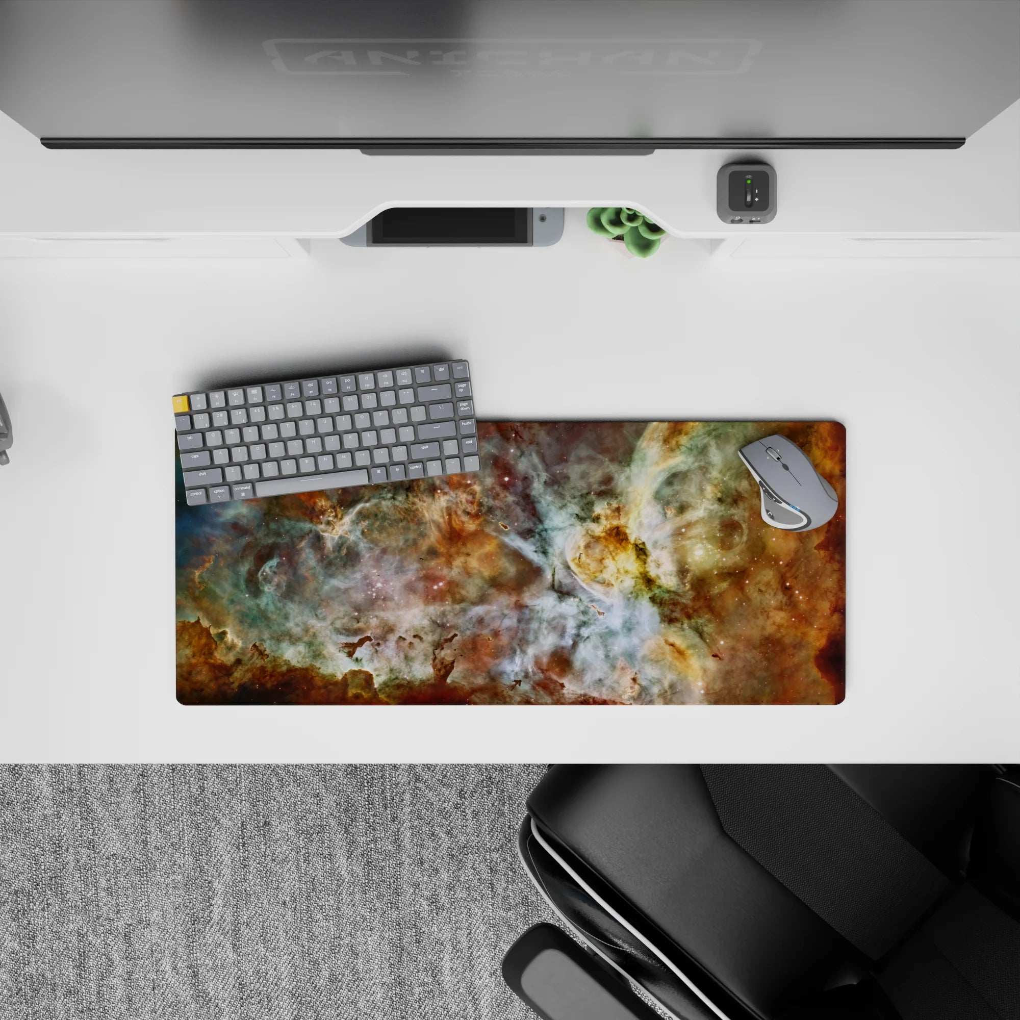 Large 28x12 inch mouse pad with dreamy nebula print in teal, gold, and white tones adding calm cosmic style.