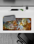 Large 28x12 inch mouse pad with dreamy nebula print in teal, gold, and white tones adding calm cosmic style.