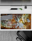 Cosmic nebula mouse pad with smoky teal, gold, and white swirls, 32x16 inches, ideal for stylish desk setups.