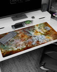 Cosmic nebula desk pad 40x20 inches with teal, gold, and white swirls adding a calm and elegant workspace touch.