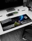 36x16 inches anime desk pad showing spiky-haired boy and pink-bob girl on the moon under a huge planet.