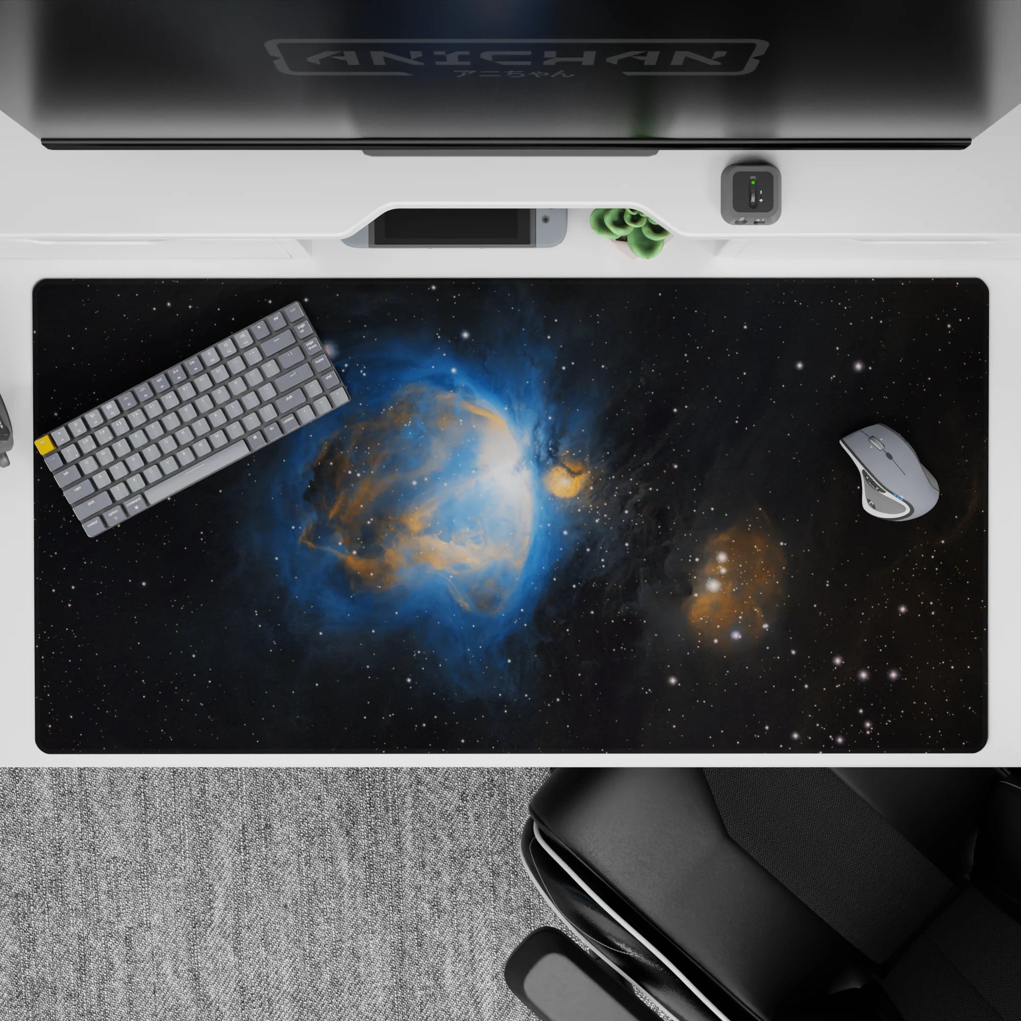 Large 40x20 inch desk pad with black and blue nebula design, featuring amber clouds and scattered stars.