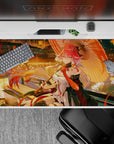 Cozy lantern glow desk pad 40x20 inches in gold, coral, and red with rippling water reflections.
