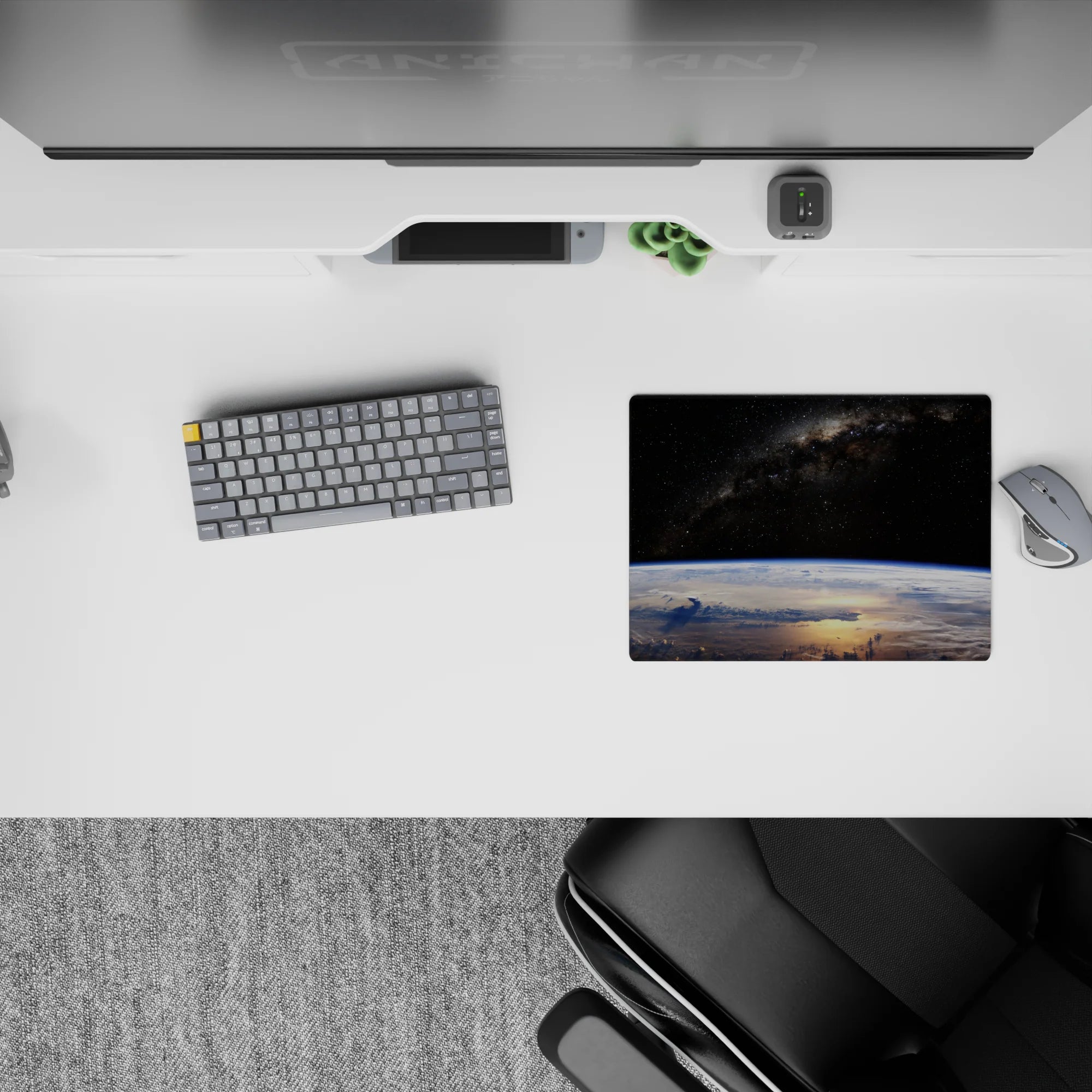 Velvet-black starry mouse pad with cool blue Earth glow, 14x10 inches.