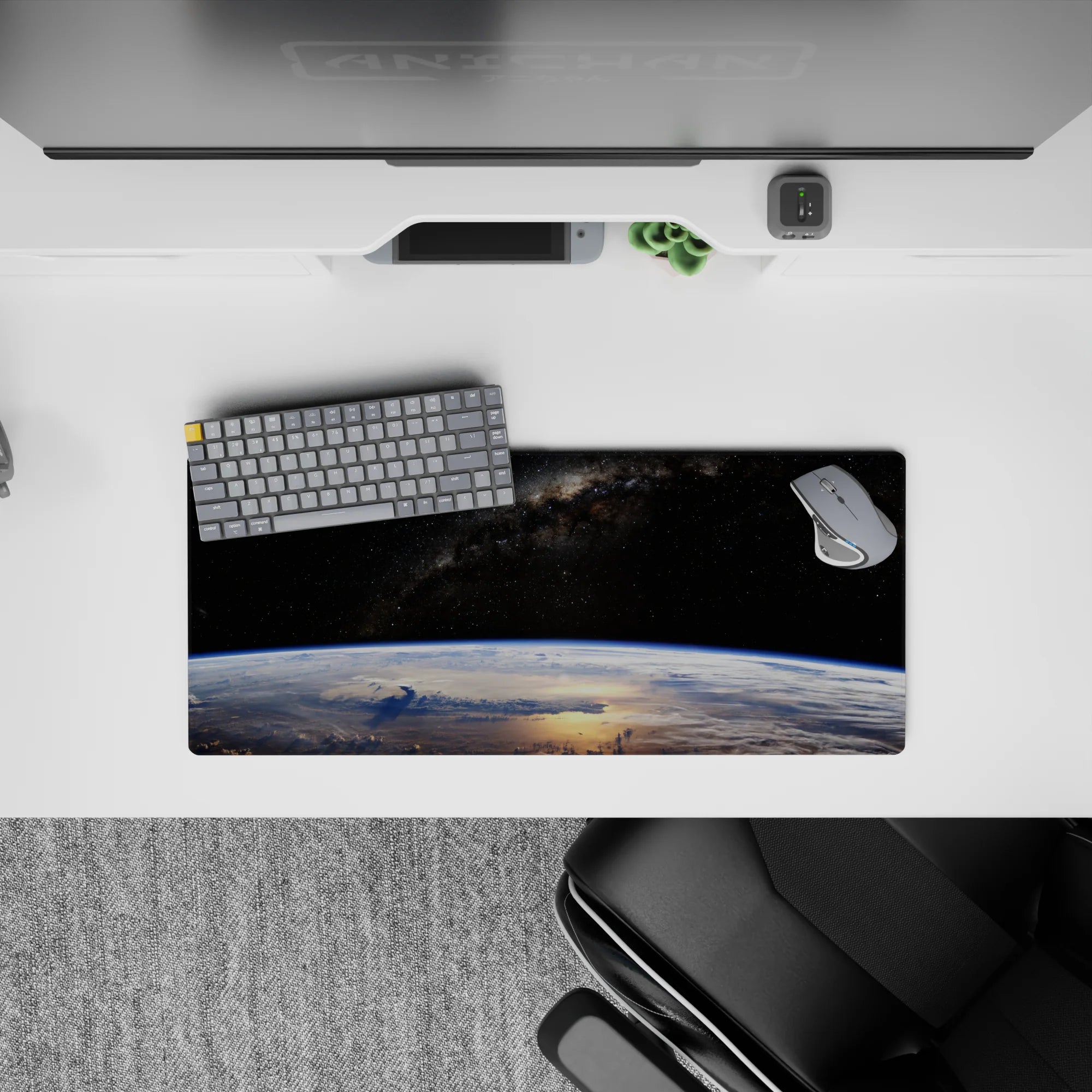 Velvet-black starfield mouse pad, 28x12 inches, cool blue Earth glow with calm late-night vibe.