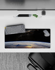 Velvet-black starfield mouse pad, 28x12 inches, cool blue Earth glow with calm late-night vibe.