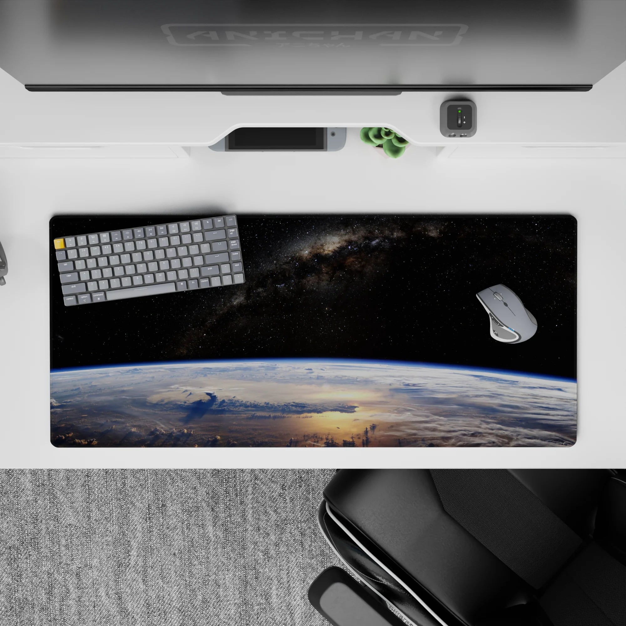 Velvet-black 36x16 inches desk pad with cool blue Earth glow and soft clouds for a calm, epic mood.
