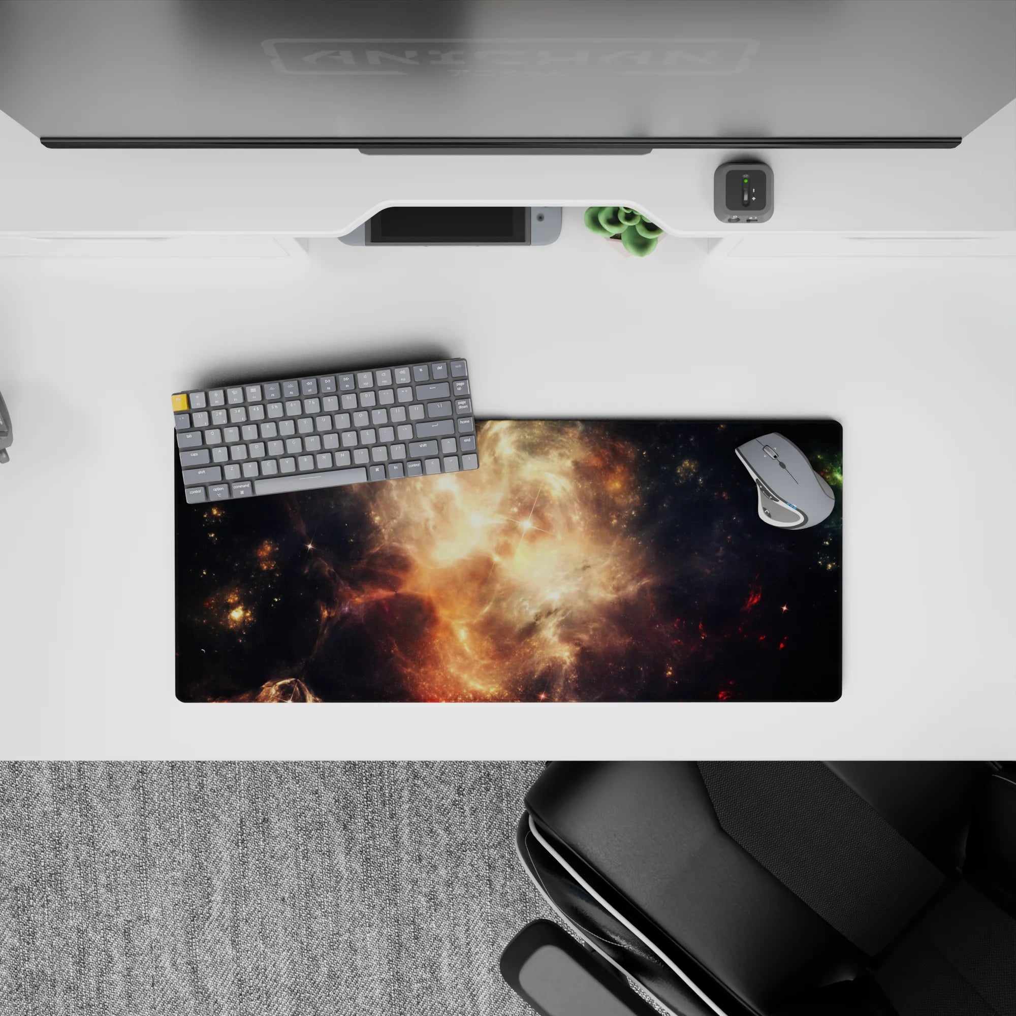 Moody space mouse pad 28x12 inches in smoky black with honey-gold amber sparks and soft glow.