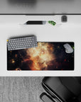 Moody space mouse pad 28x12 inches in smoky black with honey-gold amber sparks and soft glow.