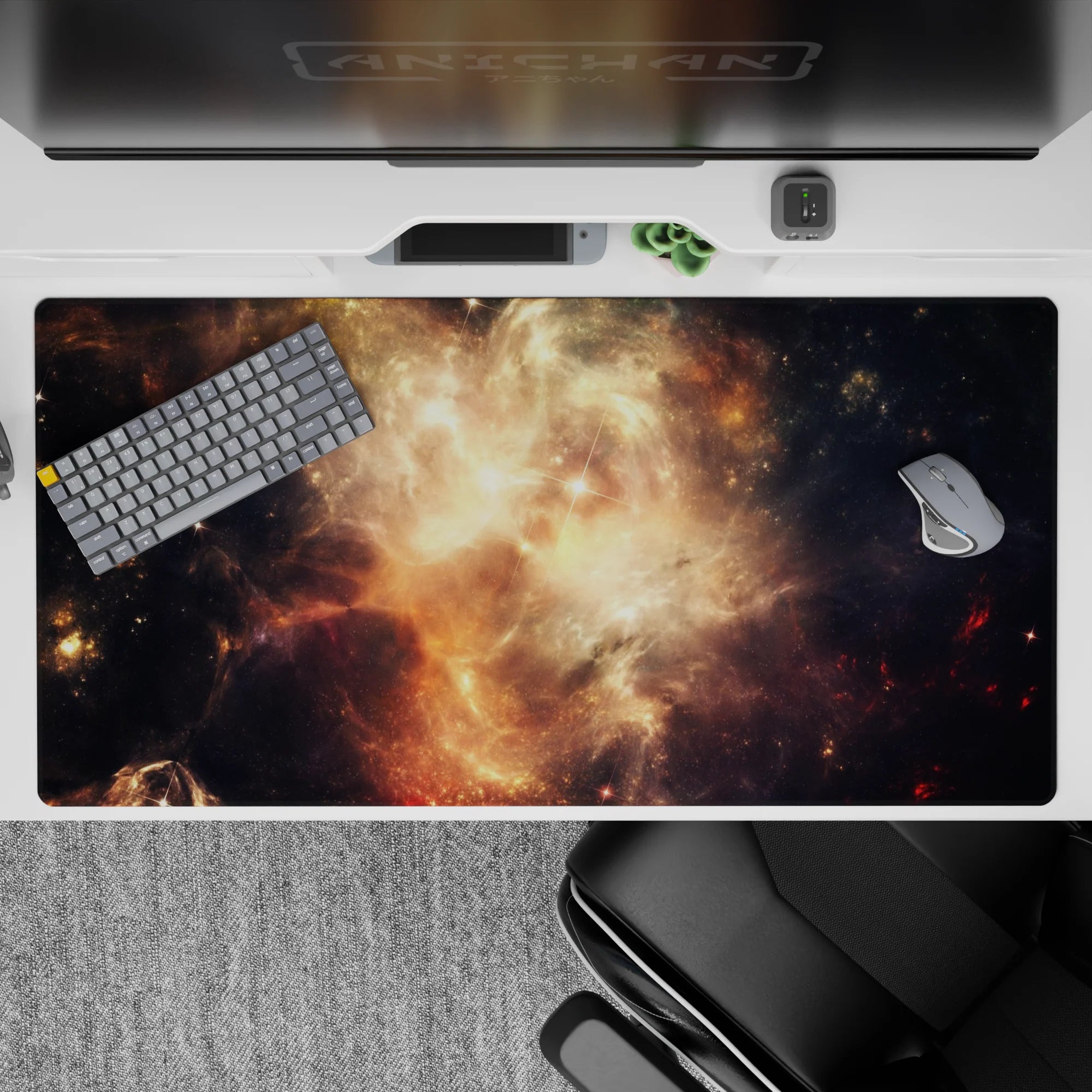 Moody space desk pad 40x20 inches in smoky black and honey-gold amber glow with dreamy star sparks.