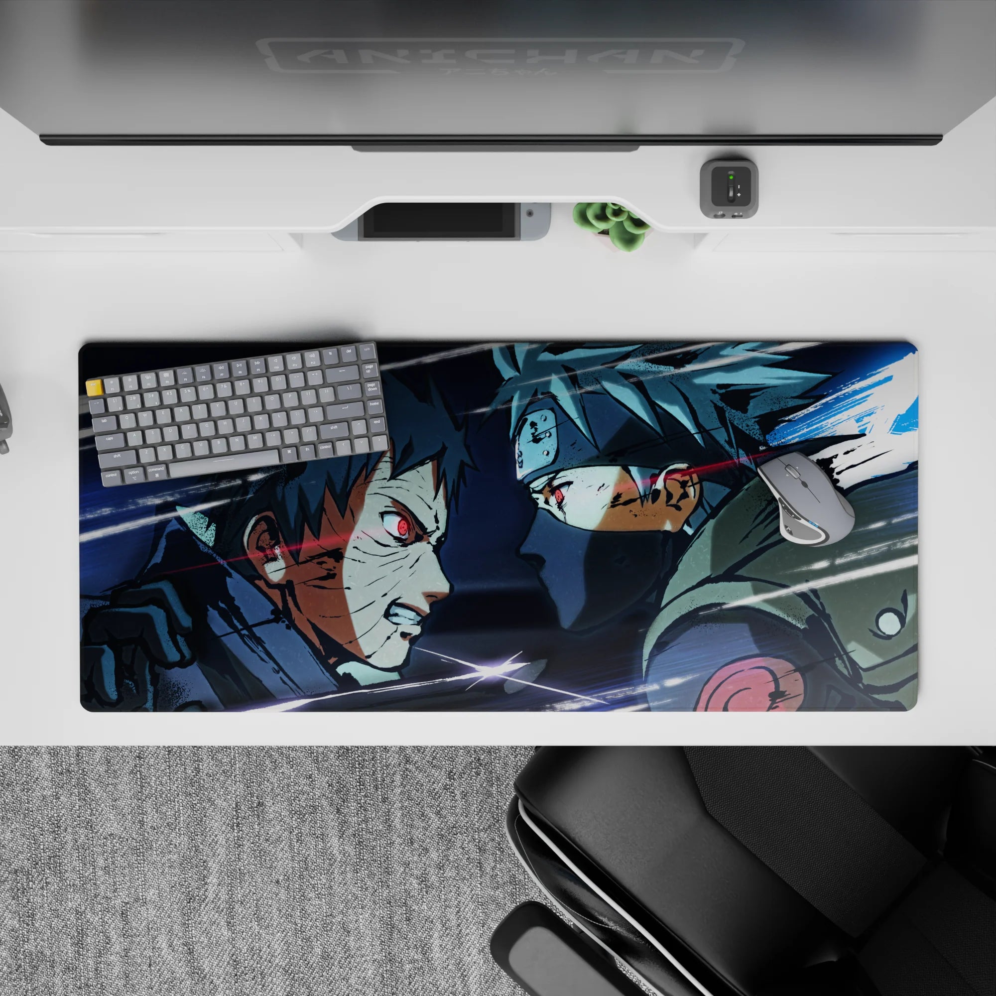 36x16 inches anime desk pad in icy blues and smoky grays with glowing red Sharingan sparks.