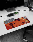 28x12 inches anime mouse pad showing a blond scarfed hero tumbling midair, sword ready over ruins.