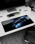 Sleek starship cutting through a glowing blue trail on a 32x16 inches mouse pad in deep space.