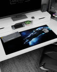 Starship cutting through a blue trail on desk pad 36x16 inches, with tiny stars in deep space.