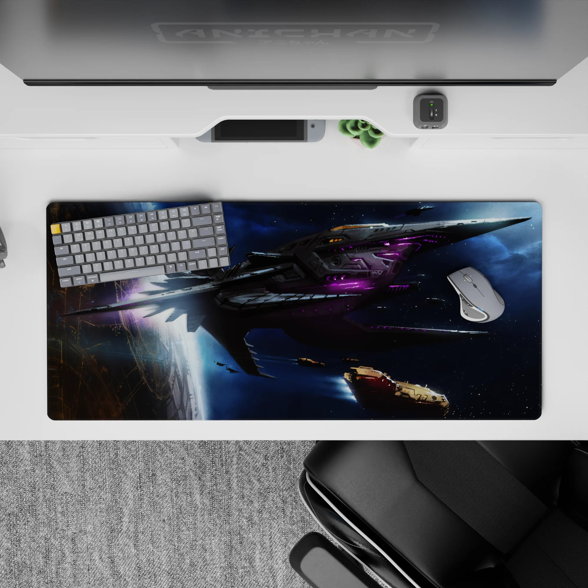 Midnight-blue and violet glow space desk pad, dark charcoal and neon purple, 36x16 inches.