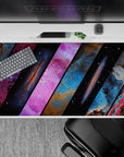 Midnight black desk pad, 40x20 inches, with dreamy blues and hot pink nebula vibes.