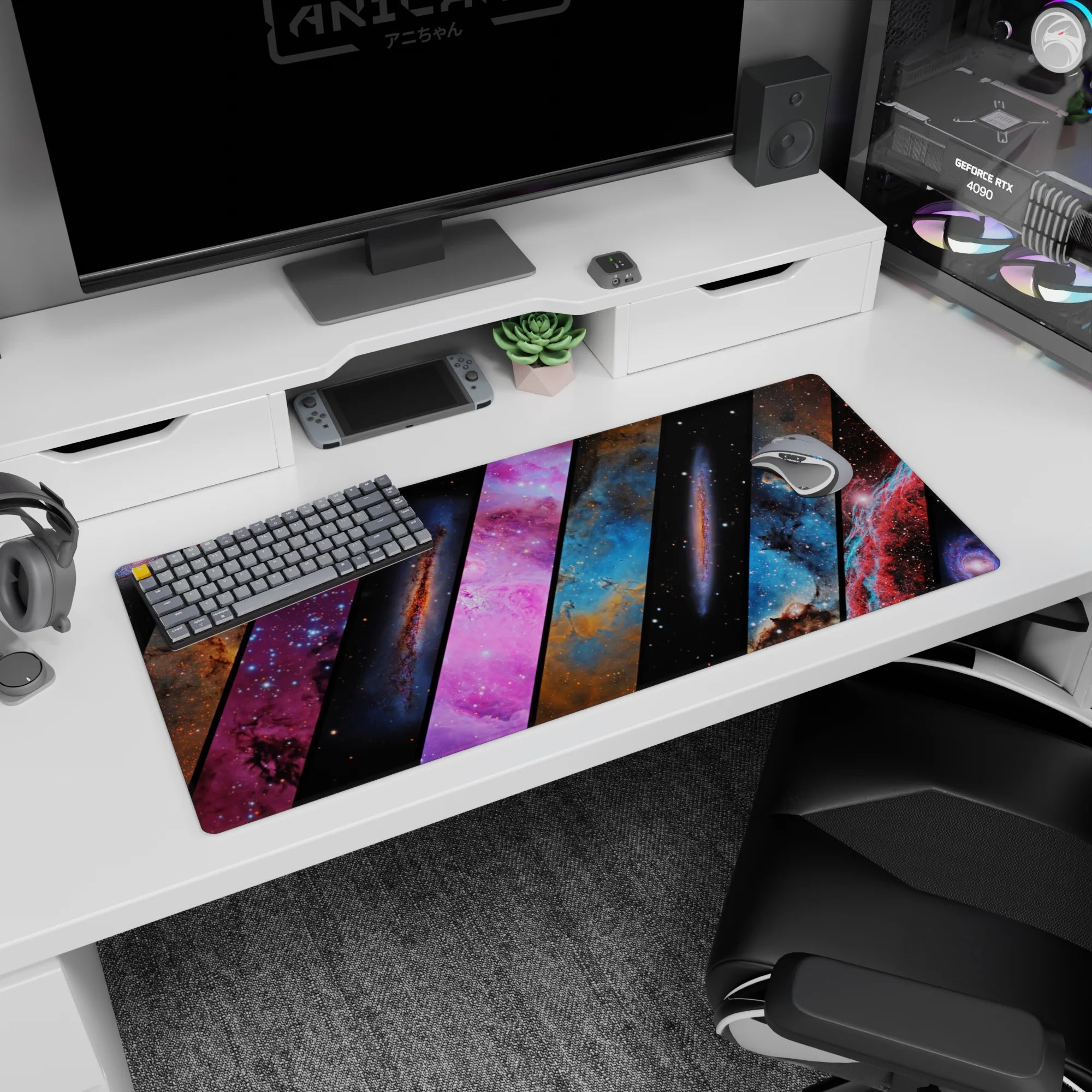 Deep space scene desk pad, 36x16 inches, featuring sliced nebula panels and peppered starfield.