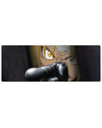 32x12 inches anime mouse pad with close-up blond fighter, gold eyes, and gun barrel foreground detail.