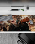Anime girl desk pad 36x16 inches in smoky browns and stormy grays, brass bullet confetti, red specks.