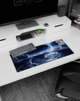 Glowing planet over swirling storm-cloud vortex extended gaming mouse pad, 28x12 inches.