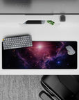 Deep navy and violet haze mouse pad, 32x12 inches, with soft pink sunrise glow and calm mood.