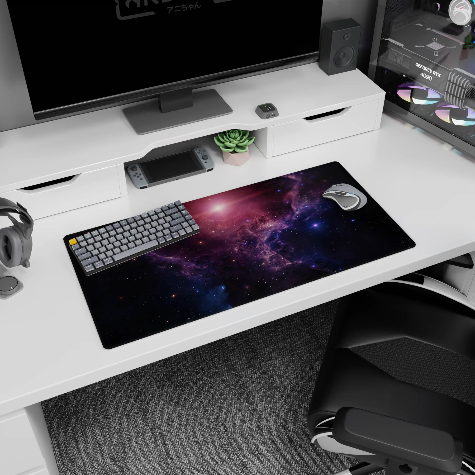 Dreamy star-speckled galaxy scene mouse pad, 32x16 inches, with swirling nebula haze across the desk.