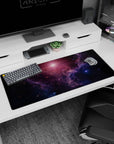Star-speckled galaxy desk pad 36x16 inches showing a painted-look nebula and distant sunrise haze.