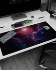 Star-speckled galaxy scene desk pad with painted cloud textures, 40x20 inches.
