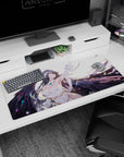 Albedo desk pad 36x16 inches featuring her fierce yet serene gaze, with flowing hair and wings, on a soft white background.