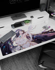Albedo from Overlord graces this 40x20 inch anime desk pad with her fierce and serene presence, amid a feathered backdrop.