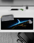 Moody 32x12 inches mouse pad in inky black and smoky gray with electric cyan streaks and calm sci-fi vibe.