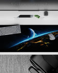 Sci-fi calm desk pad 36x16 inches in inky black, smoky gray, and electric cyan streaks.