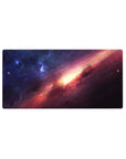 Galaxy nebula desk mouse pad 32x16 inches with sweeping starry streak and glowing golden center.