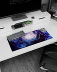 Portal-like spiral nebula scene mouse pad, 28x12 inches, swirling toward a glowing center with starlit shadows.